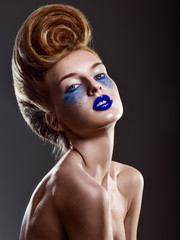 Beautiful woman with magnificent hairstyle. professional makeup.