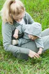 Fototapeta premium Beautiful Mother And Baby outdoors. Nature. Mum and her Child pl