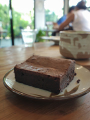  Chocolate brownie on a wooden table
