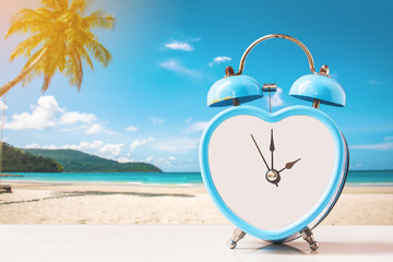 old and rusty retro clock on tropical white sand beach ,abstract background to memory of vacation.