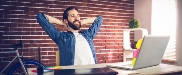 Creative businessman relaxing in office