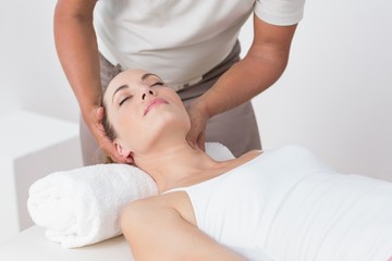 Woman receiving neck massage 