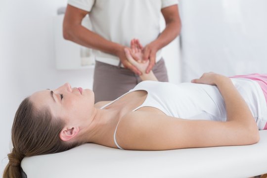 Physiotherapist doing hand massage 