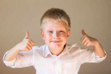 boy showing thumbs up