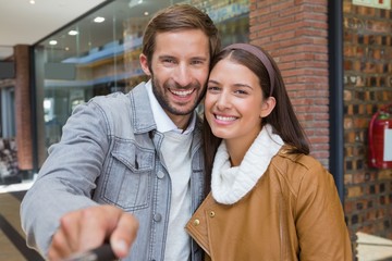 Young happy couple taking a selfie