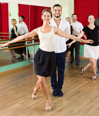 Tree elegant couples dancing waltz