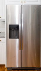 Stainless Steel Refigerator with White Cabinets