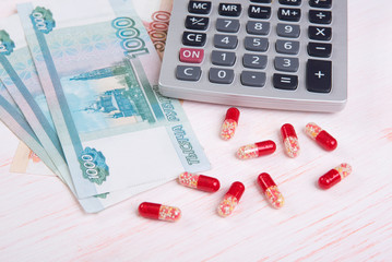 Pills and money. Health care concept