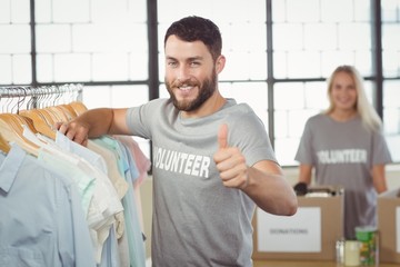 Portrait of happy man gesturing thumbs up 