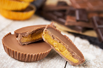 Homemade peanut butter cups on a rustic table