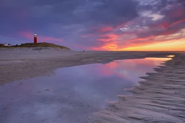 Gardinen Lighthouse on Texel island in The Netherlands at sunset © sara_winter