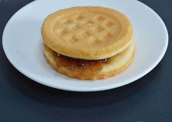 bread filling blueberry jam on dish