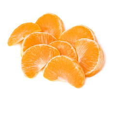 Pile of slice sections of tangerine isolated over the white