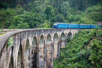 Train passing over Nine Arches Bridge in Demodara, Sri Lanka. One of major tourist attraction in...