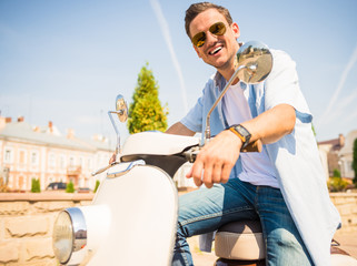 Naklejka premium Riding on scooter