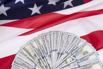 One hundred dollar bills with American flag