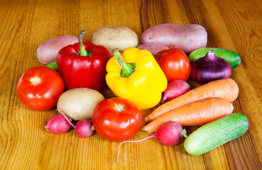 Composition with raw vegetables on wooden table