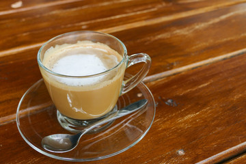 hot cappuccino coffee in glass cup