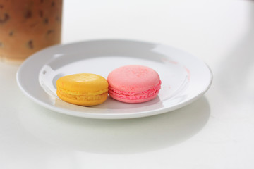 Sweet and colourful french macarons on white table