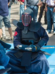 Kendo Warrior on His Knees fighting in Traditional Clothes and B