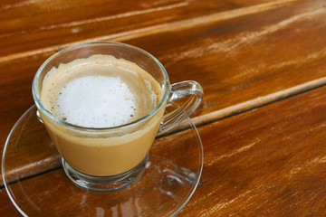 hot cappuccino coffee in glass cup