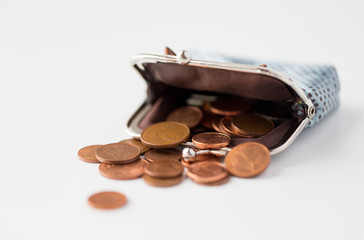 close up of euro coins and wallet on table