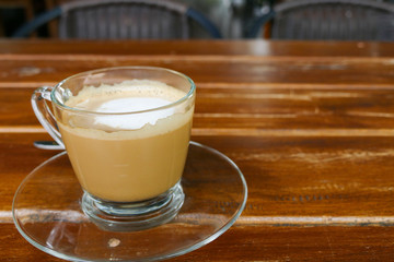 hot cappuccino coffee in glass cup
