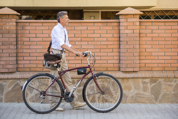 Senior man with bicycle