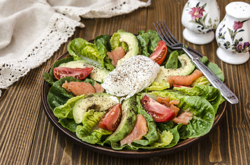 Avocado Salad with Romano tomato salmon and poached egg seasoned dressing green oil  