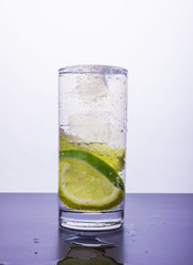 Soda with lemon and lime in the glass
