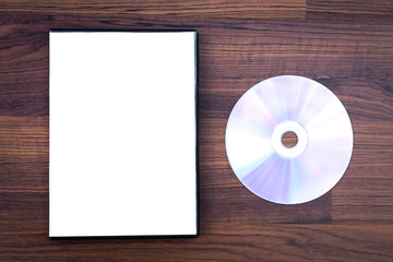 Blank compact disc with cover on wood background ground