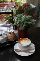 Cup of latte coffee on wooden