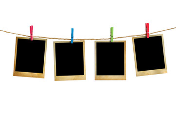 Old picture frame hanging on clothesline white background.
