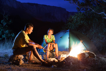 Camping with campfire at night