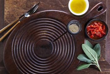 empty board for cutting on the old wooden background and olive o