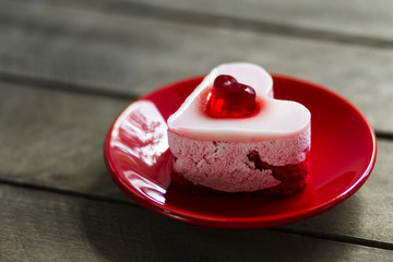 cream cake in the form of hearts and black coffee