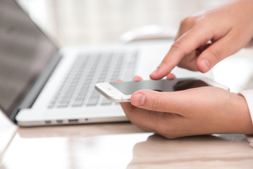 Woman hand hold smart phone with blank empty screen