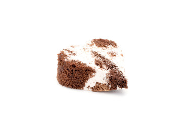a piece of cake in the form of heart isolated on a white background