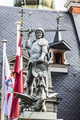 Fototapeta premium The historic House of the Blackheads with the steeple of St. Pet