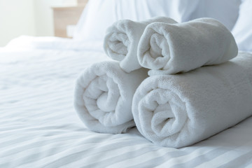 Obraz na płótnie Canvas white bath towels in bed room, Room service