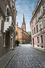 Fototapeta premium Morning street in medieval town of old Riga city, Latvia. Walkin