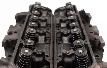 Opened old v8 engine heads showing valves and springs