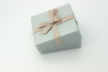 Silver gift box with a bow