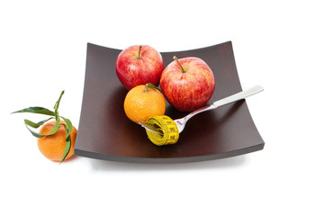 the mandarins and apple isolated on white