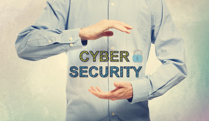 Young man in blue shirt holding Cyber Security