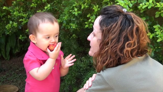 Baby and Mother eating fruit