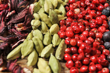 dried hibiscus flowers, green cardamom, pink peppercorns and jun