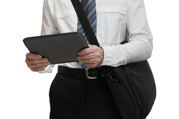 Businessman with tie holding a briefcase and tablet pc