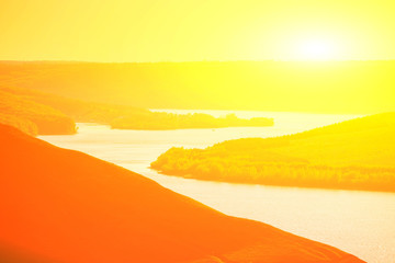 sunset over the river in mountains