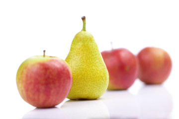 Pear and red apples isolated on white background
